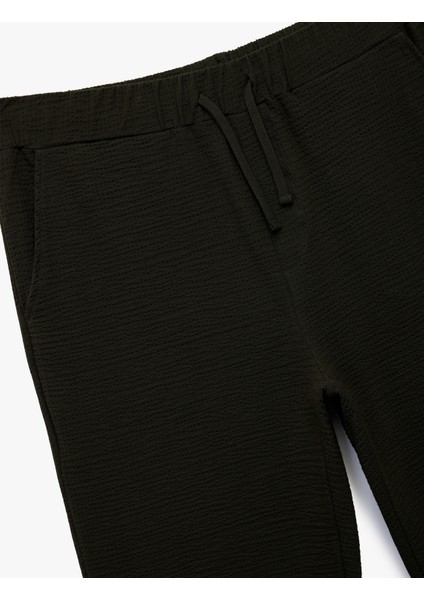 Pamuklu Dokulu Cep Detaylı Beli Bağcıklı Eşofman Altı modelleri