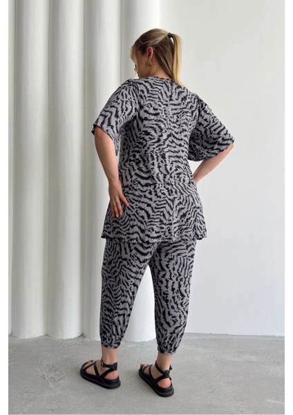 Büyük Beden V Yaka Kısa Kollu Eteği Bollaşan Desenli Bluz 99-5 indirimleri