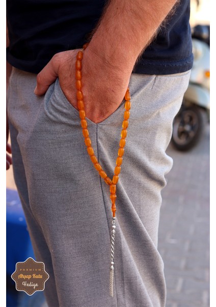 Hareli Sarı Kapsül Kesim Örgü Gümüş Püsküllü Sıkma Kehribar Tesbih 201024539 indirimleri