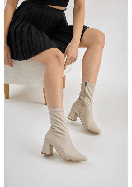Kadın Bej Tpu Taban Küt Burunlu Fermuarlı Topuklu Bot modelleri