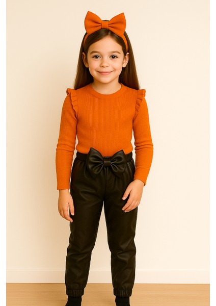 kız Çocuk, 3 Lü Set Siyah Deri Fiyonk Detaylı Pantolon, Turuncu Omuzu Fırfırlı Badi ve Saç Bandı Takımı.
