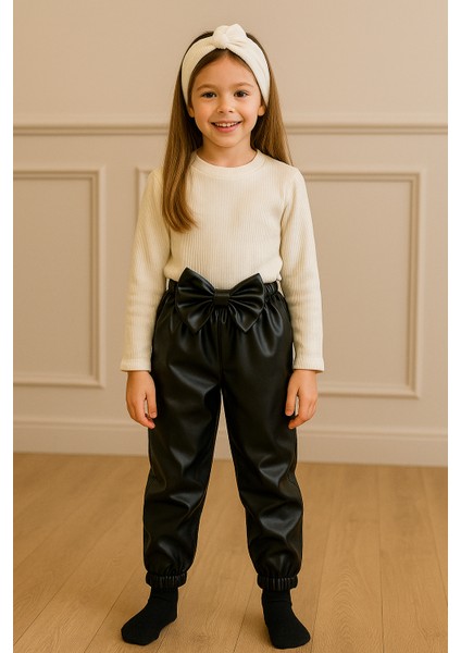 Kız Çocuk, Siyah Deri Fiyonk Detaylı Pantolon, Krem Omuzu Fırfırlı Badi ve Saç Bandı Takımı