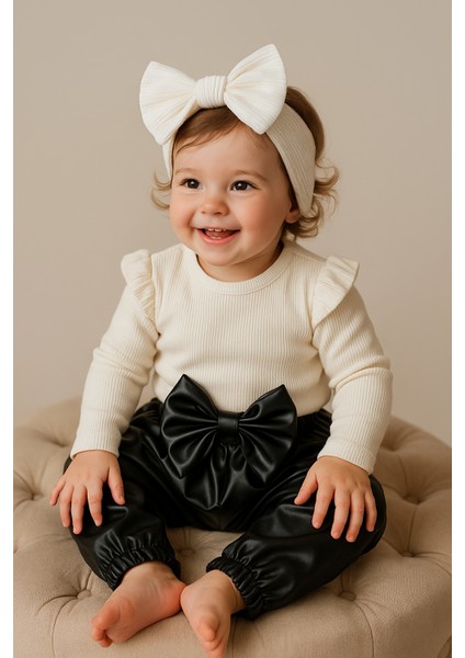 Kız Çocuk, Siyah Deri Fiyonk Detaylı Pantolon, Krem Omuzu Fırfırlı Badi ve Saç Bandı Takımı