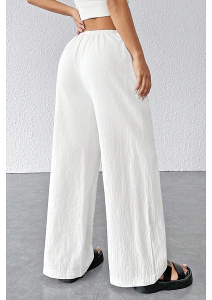 Kadın Beyaz Bol Kesim Cepli Geniş Paça Dökümlü Pantolon fiyatları