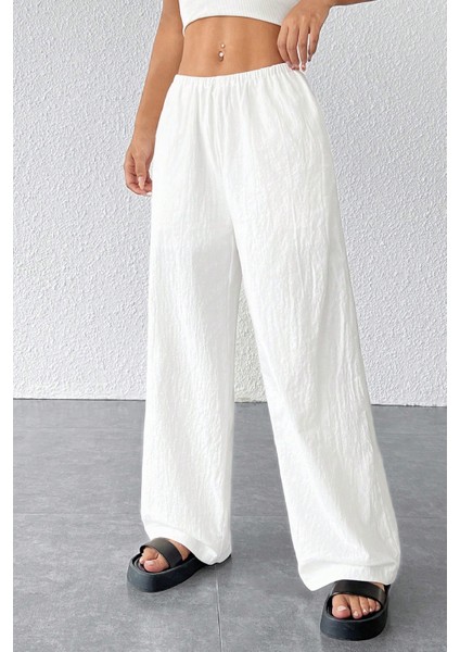 Kadın Beyaz Bol Kesim Cepli Geniş Paça Dökümlü Pantolon fırsatları