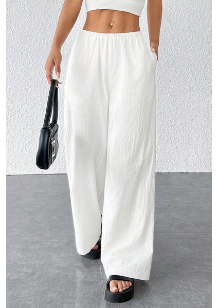 Kadın Beyaz Bol Kesim Cepli Geniş Paça Dökümlü Pantolon indirimleri