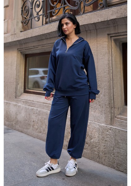 Kadın Yarım Fermuarlı Sweatshırt ve Paçası Lastikli Eşofman Takımı fırsatları