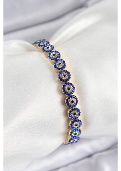 Pirinç Zirkon Taşlı Lacivert Nazar Model Gold Renk Lastikli Kadın Bileklik - Lisinya