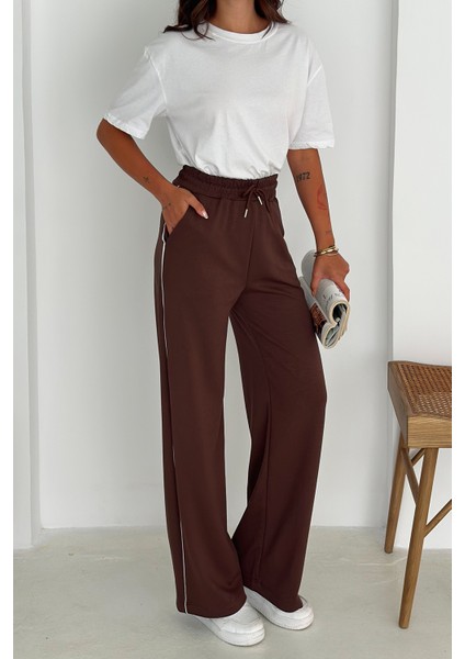 Kadın Lastikli Bel Bağcıklı Bol Paça Pantolon – Rahat & Minimal Stil fiyatları