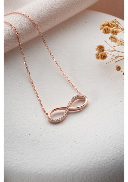 925 Ayar Gümüş Rose Kaplama Zirkon Taşlı Sonsuzluk Model Küpe indirimleri