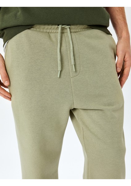 Pamuk Karışımlı Cep Detaylı Regular Fit Şardonlu Beli Bağcıklı Eşofman Altı indirimleri