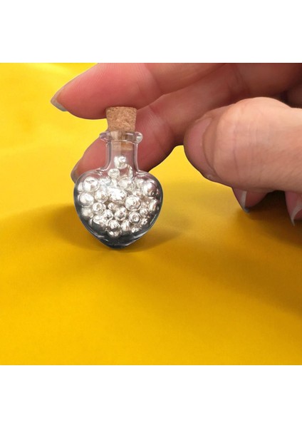 15 Gram Kalp Tasarımlı Cam Şişeli, 999 Ayar Gümüşten Üretilmiş Özel Granül Gümüş HEDIYESI-553 fırsatları