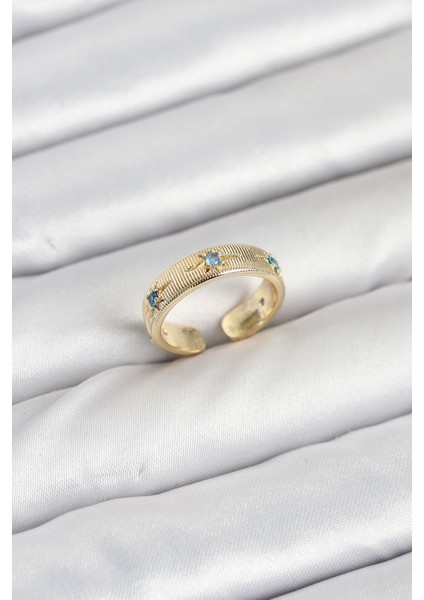 Pirinç Gold Renk Mavi Zirkon Taşlı Kutup Yıldızı Model Kadın Yüzük