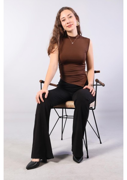 10642 Eteği Asimetrik Balıkçı Kolsuz Bluz indirimleri