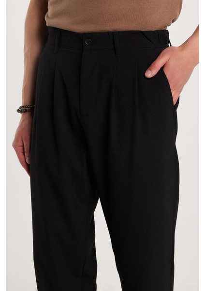 Erkek regular Fit Çift Pileli Beli Lastikli Rahat Kesim Bol Paça Baggy siyah Pantolon fiyatları