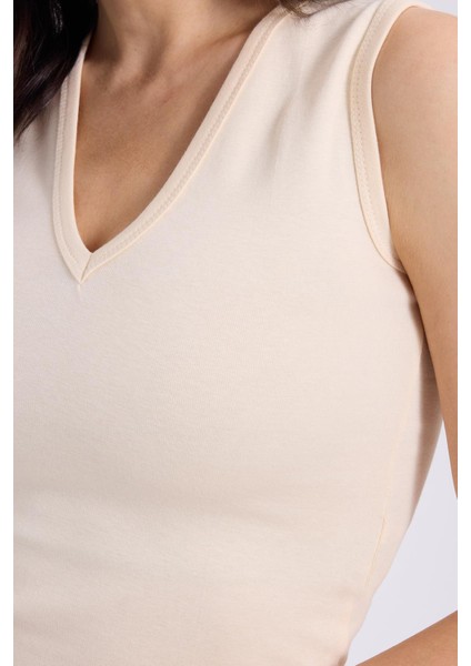 Kadın Slim Fit Dar Kesim V Yaka Sıfır Kol Pamuklu Ribanalı Bej Bluz fırsatları