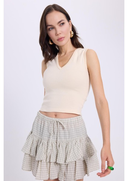 Kadın Slim Fit Dar Kesim V Yaka Sıfır Kol Pamuklu Ribanalı Bej Bluz indirimleri
