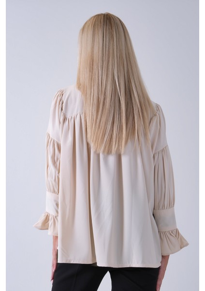 Taş Göğüs ve Manşeti Büzgü Detaylı Bluz 3972060.50 indirimleri