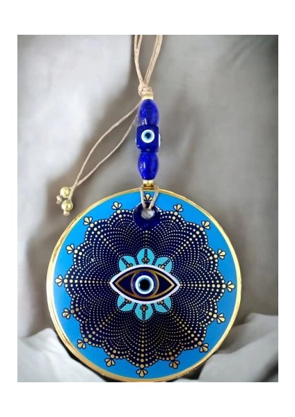 Mavi Cam Üstü Altın Puantiyeli Göz Nazar Boncuklu Duvar Süsü modelleri