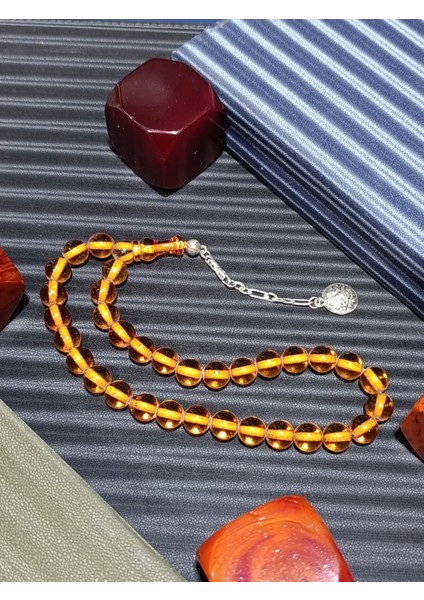 şeffaf Zarafet: Bal Rengi Sıkma Çubuk Kehribar Tesbih