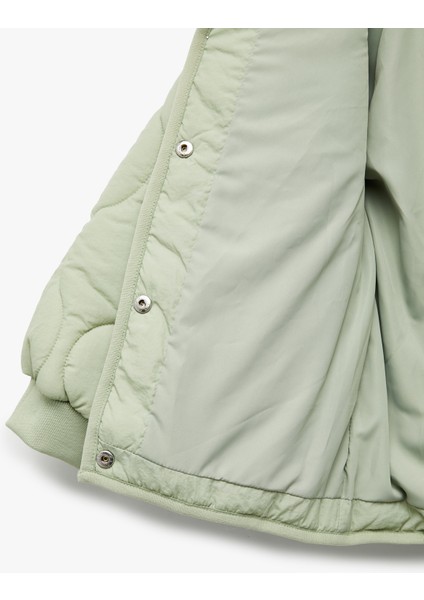 Uzun Kollu Düğmeli Kapşonlu Kapitone Mont fırsatları