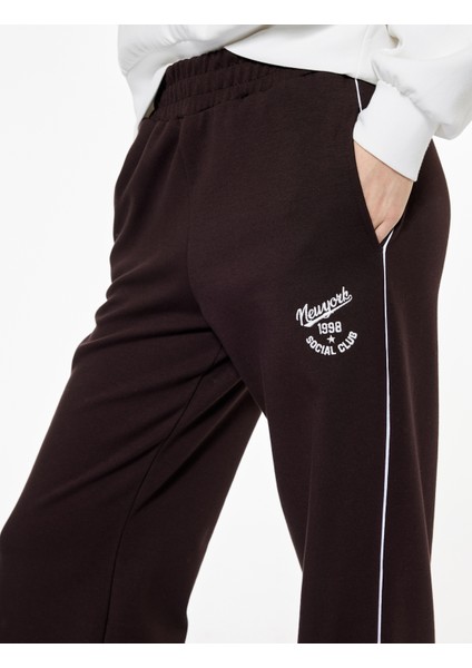 Pamuklu Şardonlu Biyeli Baskılı Beli Lastikli Geniş Paça Eşofman Altı indirimleri