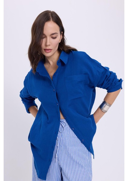 Kadın Oversize Geniş Kesim %100 Pamuk Müslin Kumaş Uzun Kollu Cepli Dokulu Saks Mavi Gömlek fiyatları