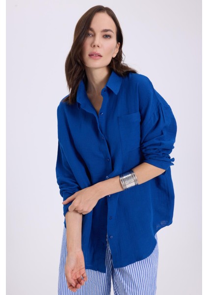 Kadın Oversize Geniş Kesim %100 Pamuk Müslin Kumaş Uzun Kollu Cepli Dokulu Saks Mavi Gömlek indirimleri