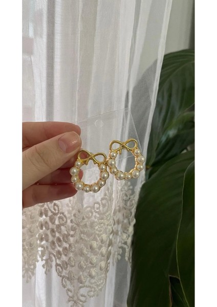 Zarafetin Işıltısı: Inci Detaylı Çelik Yuvarlak Küpe fiyatları