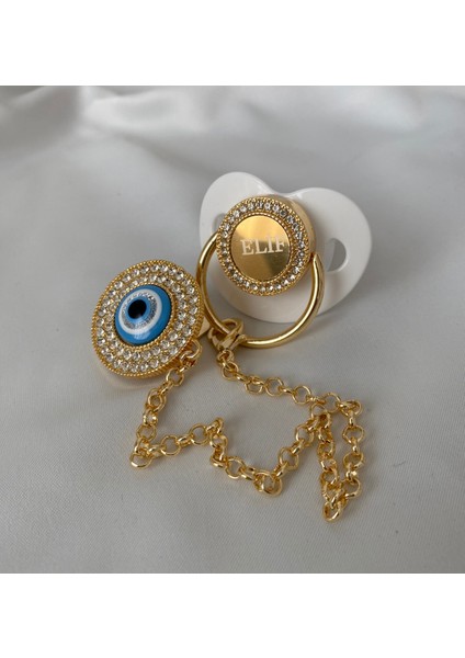Altın Kaplama Nazar Boncuklu Zirkon Emzik Seti – Maşallah Iğnesi & Bebek Künyesi Dahil modelleri
