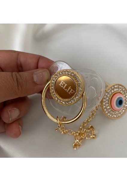 Altın Kaplama Isimli Zirkon Taşlı Silikon Emzik Seti (0-6 Ay) – Damaklı & Kişiye Özel Şeffaf