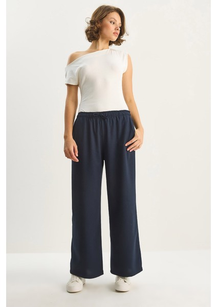 Kadın Yüksek Bel Beli Lastikli Bağlama Detaylı Cepli Kumaş Bol Pantolon