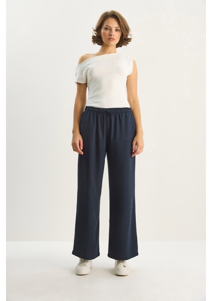 Kadın Yüksek Bel Beli Lastikli Bağlama Detaylı Cepli Kumaş Bol Pantolon fiyatları