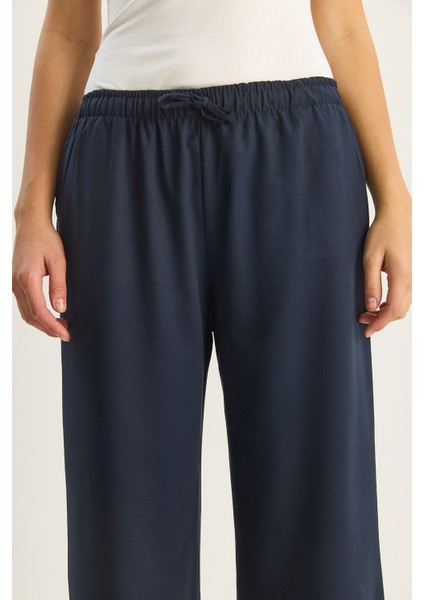 Kadın Yüksek Bel Beli Lastikli Bağlama Detaylı Cepli Kumaş Bol Pantolon indirimleri