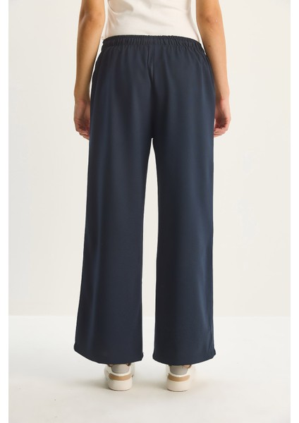 Kadın Yüksek Bel Beli Lastikli Bağlama Detaylı Cepli Kumaş Bol Pantolon