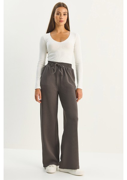 Kadın Yüksek Bel Lastikli Bağcıklı Dökümlü Bol Paça Pantolon