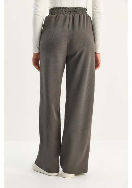 Kadın Yüksek Bel Lastikli Bağcıklı Dökümlü Bol Paça Pantolon