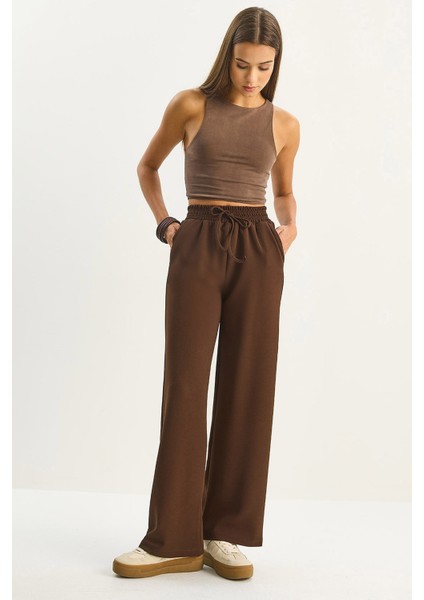 Kadın Yüksek Bel Lastikli Bağcıklı Dökümlü Bol Paça Pantolon
