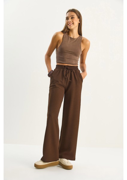 Kadın Yüksek Bel Lastikli Bağcıklı Dökümlü Bol Paça Pantolon indirimleri
