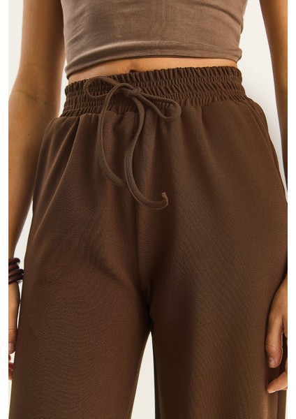 Kadın Yüksek Bel Lastikli Bağcıklı Dökümlü Bol Paça Pantolon