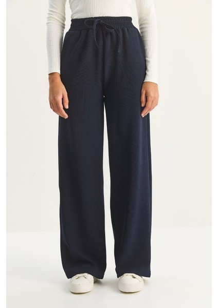 Kadın Yüksek Bel Lastikli Bağcıklı Dökümlü Bol Paça Pantolon