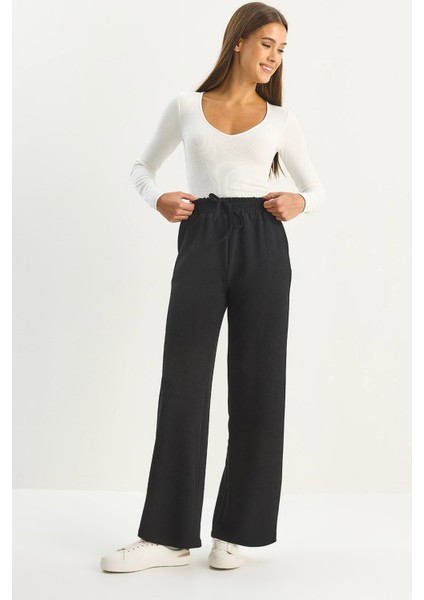 Kadın Yüksek Bel Lastikli Bağcıklı Dökümlü Bol Paça Pantolon