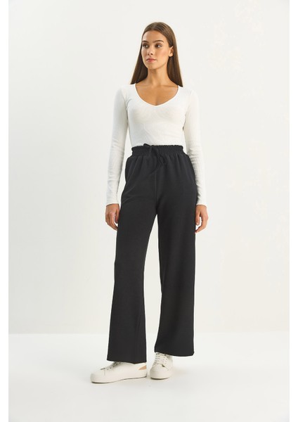 Kadın Yüksek Bel Lastikli Bağcıklı Dökümlü Bol Paça Pantolon modelleri