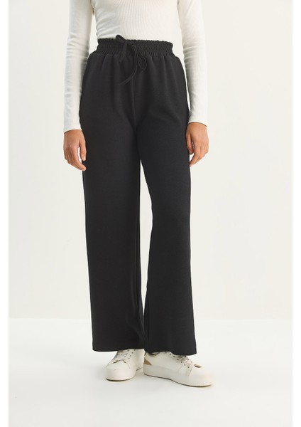 Kadın Yüksek Bel Lastikli Bağcıklı Dökümlü Bol Paça Pantolon indirimleri