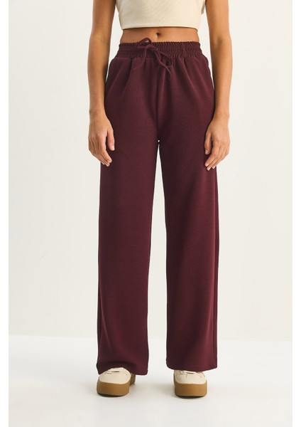 Kadın Yüksek Bel Lastikli Bağcıklı Dökümlü Bol Paça Pantolon indirimleri