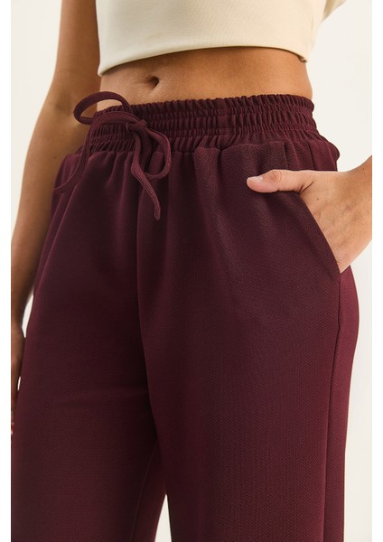 Kadın Yüksek Bel Lastikli Bağcıklı Dökümlü Bol Paça Pantolon