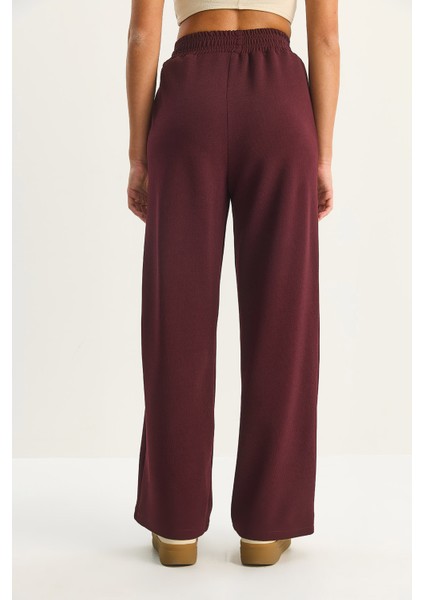 Kadın Yüksek Bel Lastikli Bağcıklı Dökümlü Bol Paça Pantolon