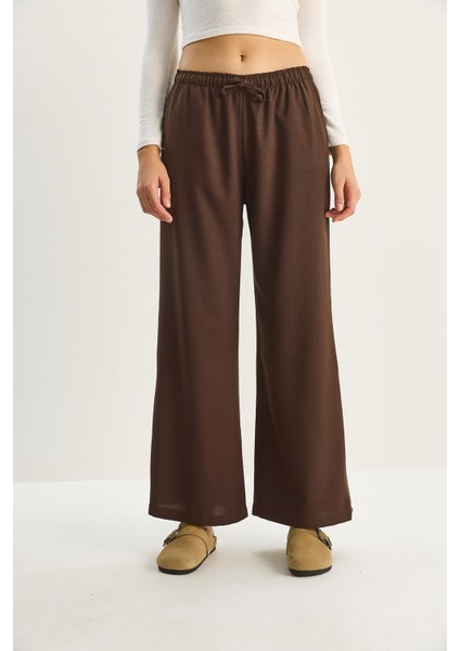 Kadın Yüksek Bel Beli Lastikli Bağlama Detaylı Cepli Kumaş Bol Pantolon fırsatları