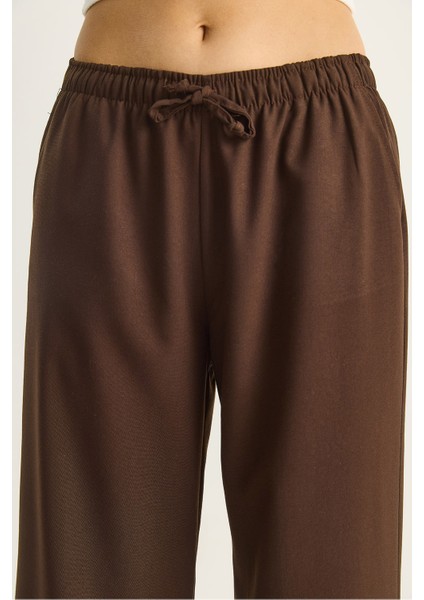 Kadın Yüksek Bel Beli Lastikli Bağlama Detaylı Cepli Kumaş Bol Pantolon indirimleri