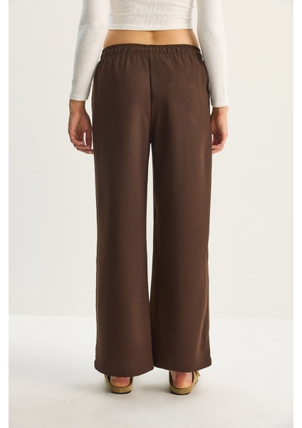 Kadın Yüksek Bel Beli Lastikli Bağlama Detaylı Cepli Kumaş Bol Pantolon